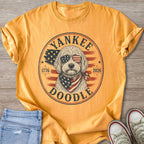 Gold t-shirt with a Doodle dog wearing patriotic sunglasses and bandana.
