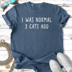 Blue t-shirt with text "I WAS NORMAL 3 CATS AGO".