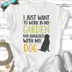 White t-shirt with "I JUST WANT TO WORK IN MY GARDEN AND HANGOUT WITH MY DOG" and a silhouette of a dog.