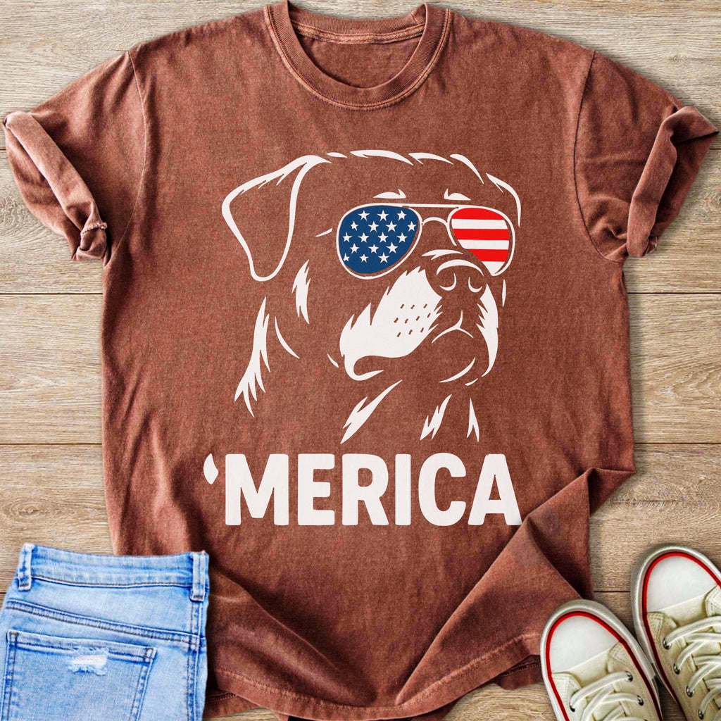 Brown t-shirt with a white outline of a dog wearing American flag sunglasses and text 'MERICA.