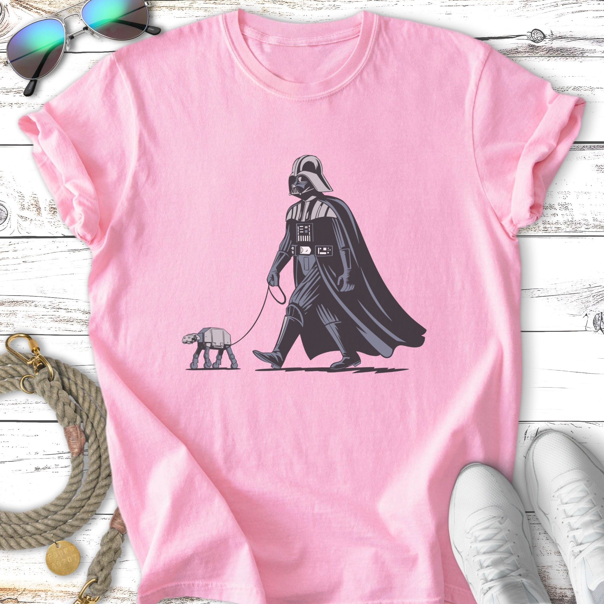Darth Vader walks an AT-ST on a leash, pink t-shirt.