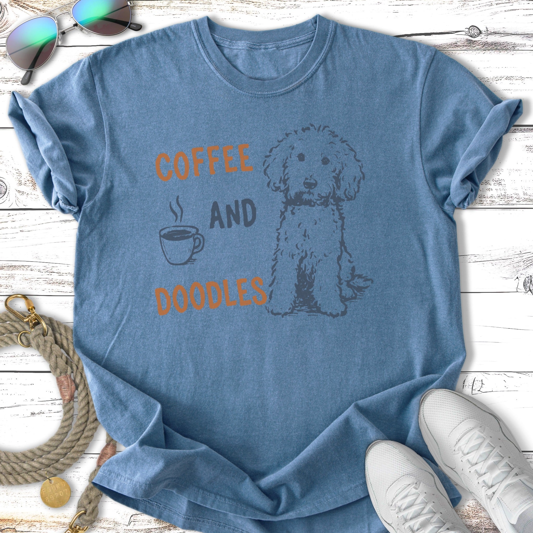 Blue t-shirt with "Coffee and Doodles" text and a doodle dog graphic.