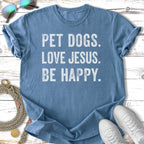 Blue t-shirt with "PET DOGS. LOVE JESUS. BE HAPPY." text.