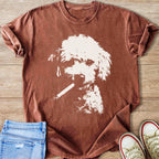 Brown t-shirt with a cream graphic of a dog holding a cigarette in its mouth.