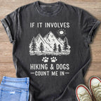 Dark t-shirt with "If it involves hiking & dogs count me in" text, mountains, and paw prints.