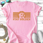 Pink t-shirt with "Stay Golden" text and a dog wearing sunglasses.