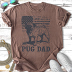 Distressed American flag with pug silhouette on brown t-shirt reading "Pug Dad".