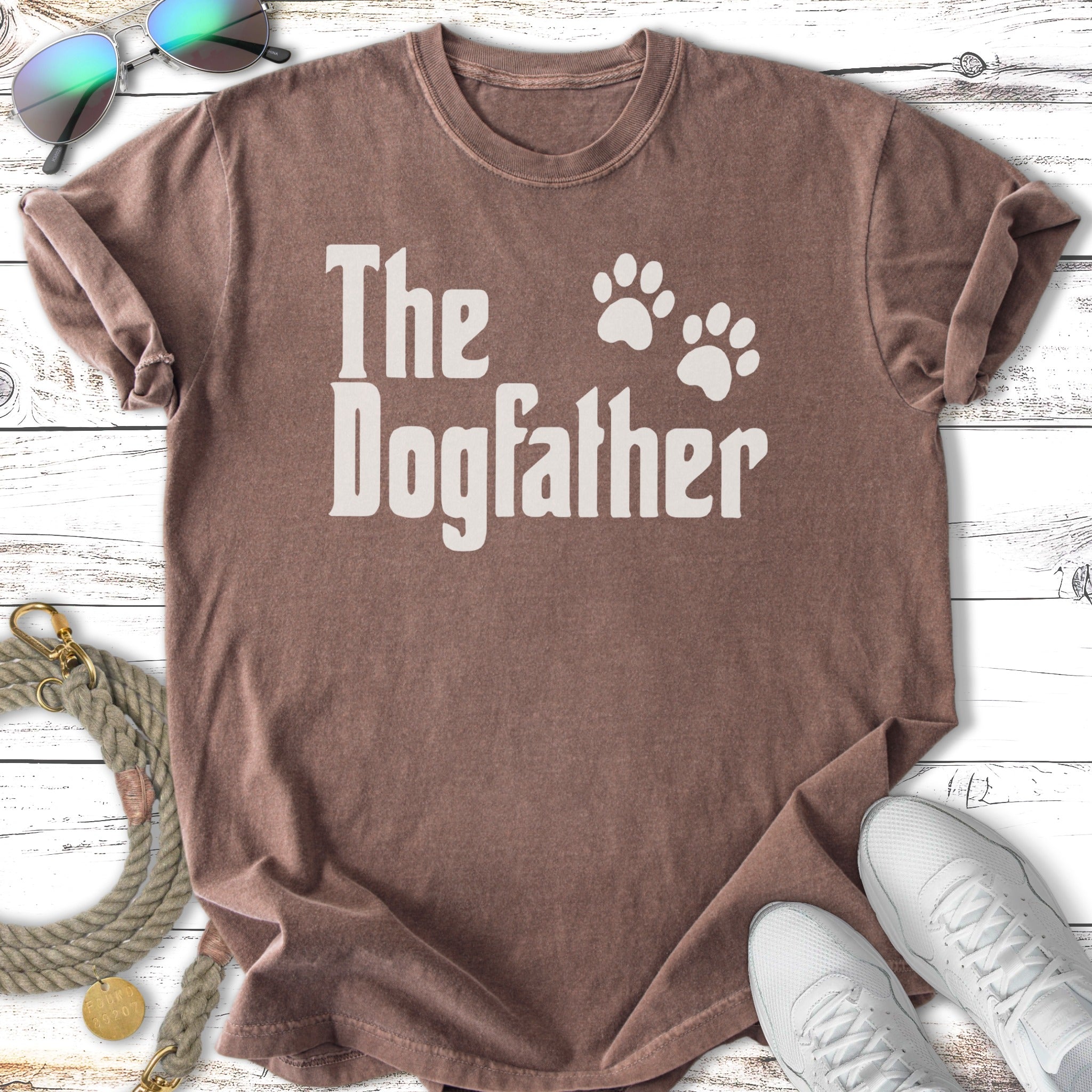 Brown t-shirt with "The Dogfather" and paw prints in white text.