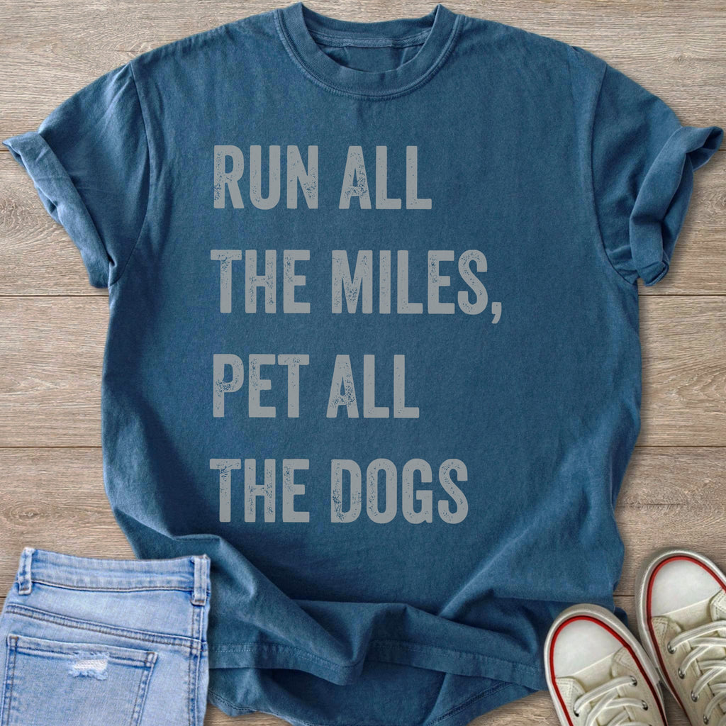 Blue t-shirt with text "RUN ALL THE MILES, PET ALL THE DOGS".