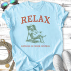 Light blue t-shirt with distressed graphic of dog relaxing in chair, text "RELAX" and "NOTHING IS UNDER CONTROL".