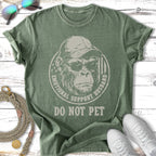Green t-shirt with a monkey wearing sunglasses and the text "Emotional Support Husband Do Not Pet".