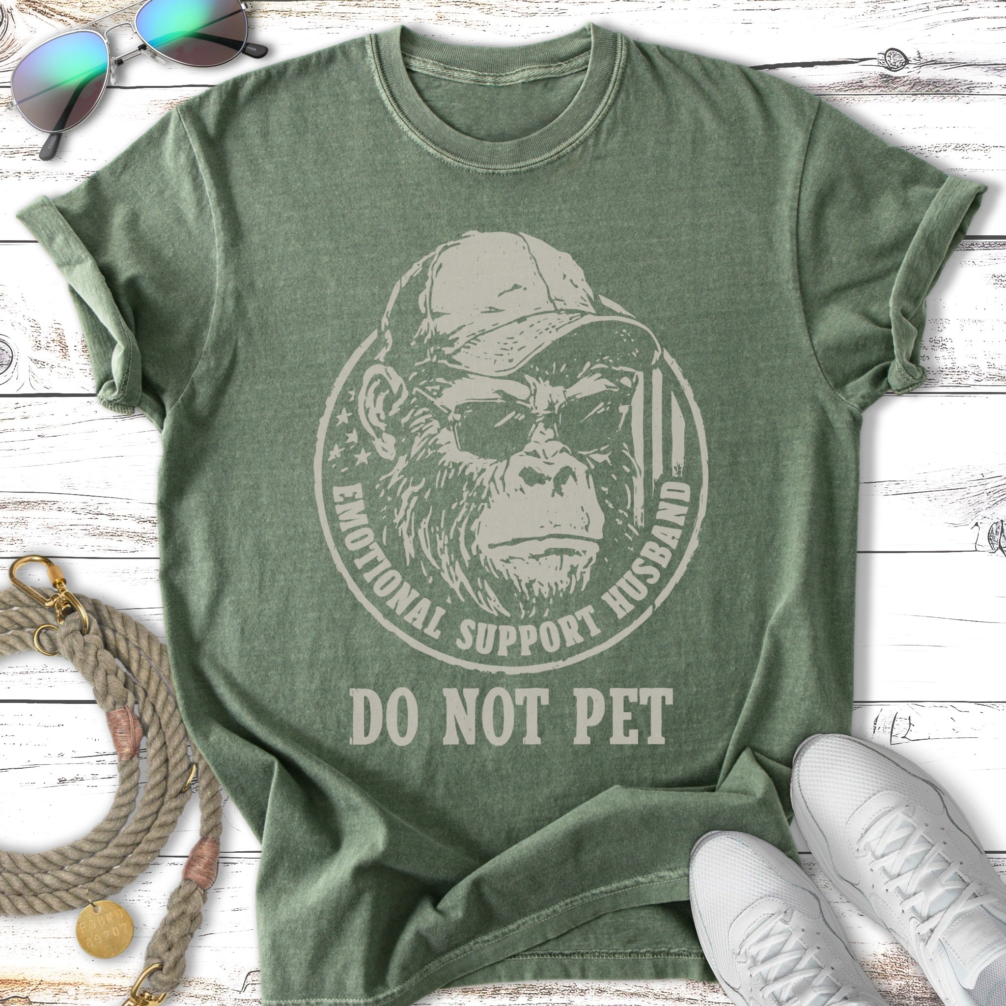 Green t-shirt with a monkey wearing sunglasses and the text "Emotional Support Husband Do Not Pet".