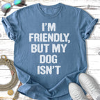 Blue t-shirt with white text "I'm friendly, but my dog isn't."
