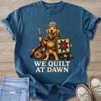 Golden retriever wearing a knight's helmet and cape, holding sewing tools and a quilt.