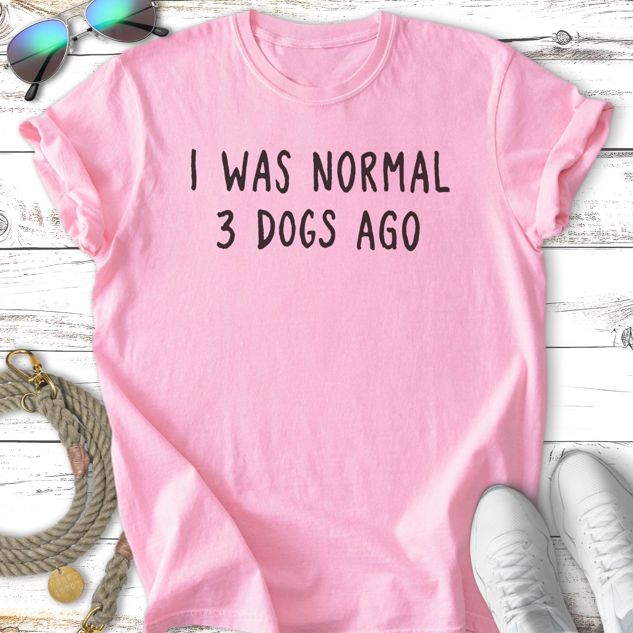 Pink t-shirt with "I WAS NORMAL 3 DOGS AGO" in black text.
