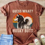 Husky dog illustration with "GUESS WHAT? HUSKY BUTT" text on t-shirt.