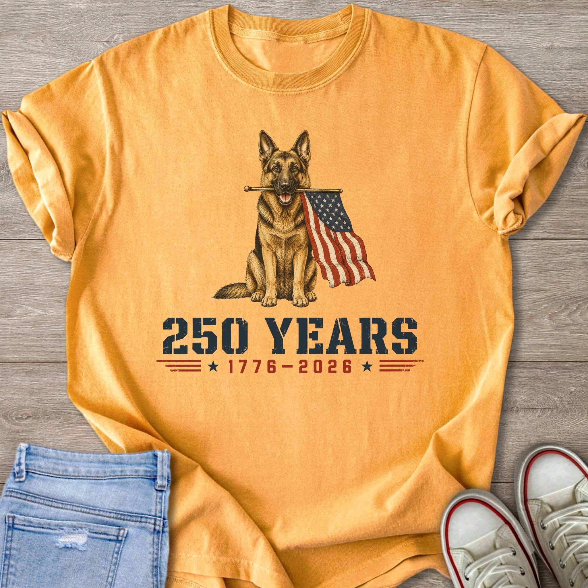 German Shepherd with American flag and "250 Years 1776-2026" text on a yellow t-shirt.