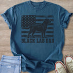 Blue t-shirt with black lab silhouette on distressed American flag and "BLACK LAB DAD" text.