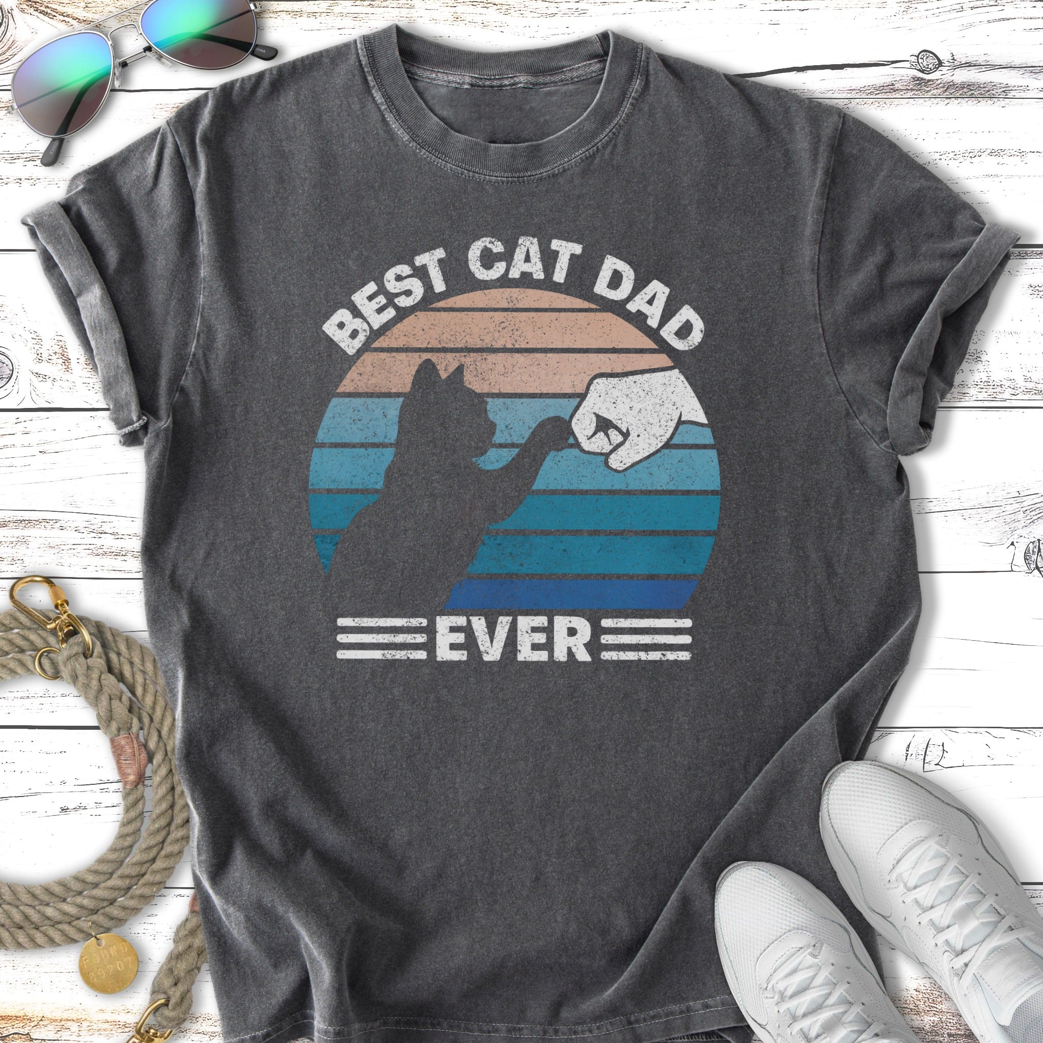 Distressed charcoal t-shirt with "Best Cat Dad Ever" text and fist bump graphic.