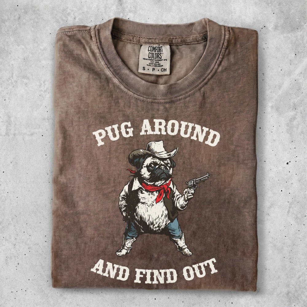 T-shirt with a cartoon pug in a cowboy hat and vest holding a gun.