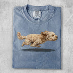 Light blue t-shirt with a distressed print of a running fluffy dog.