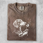 Brown t-shirt with dachshund holding dandelion and blowing seeds.