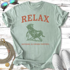 Green t-shirt with a cartoon dog in a chair, text reads "RELAX NOTHING IS UNDER CONTROL".