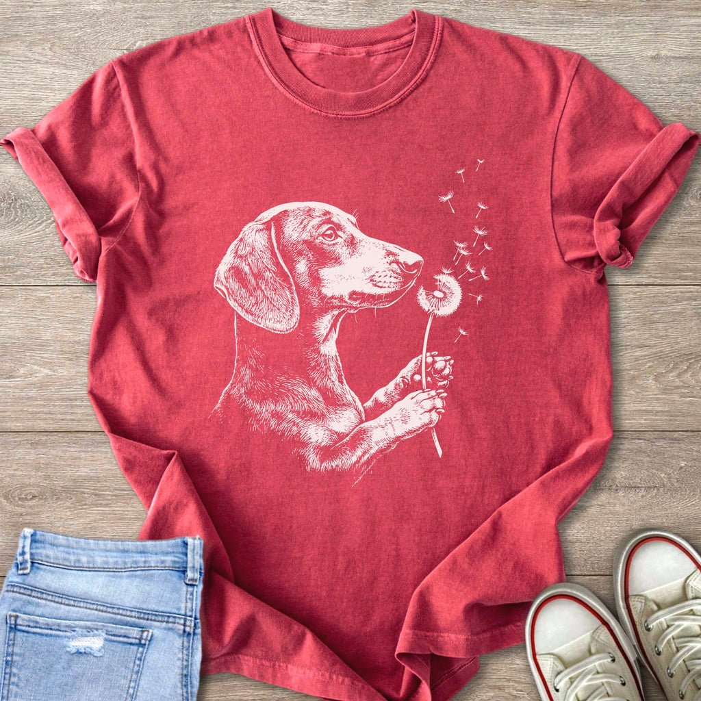 Red t-shirt with white dachshund blowing on a dandelion.