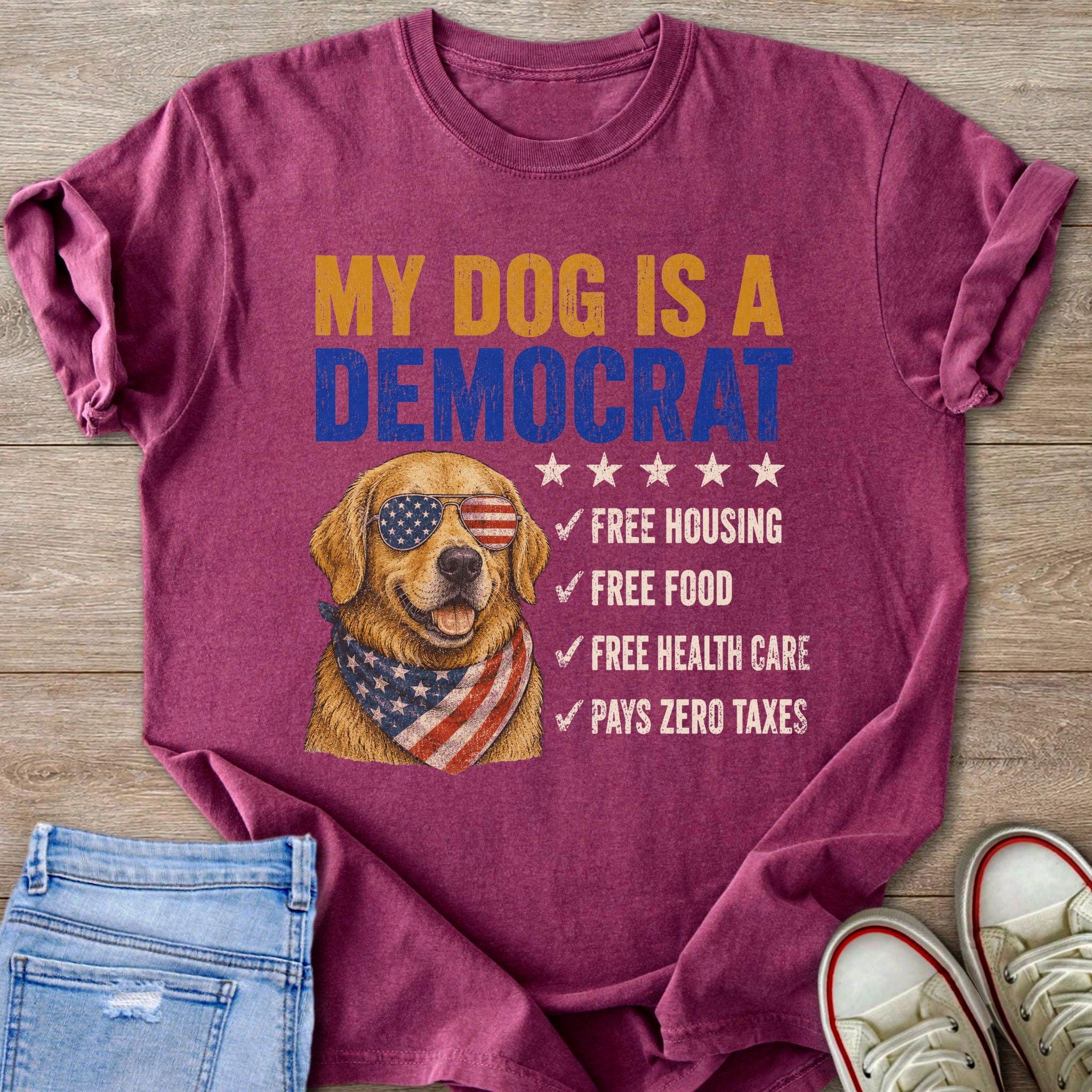 Golden retriever in sunglasses and bandana on t-shirt saying "My dog is a Democrat."