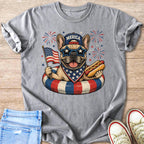 French bulldog wearing "Merica" hat, star sunglasses, holding flag and hot dog.