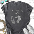 Dog wearing sunglasses drinks iced coffee, shown on charcoal t-shirt.