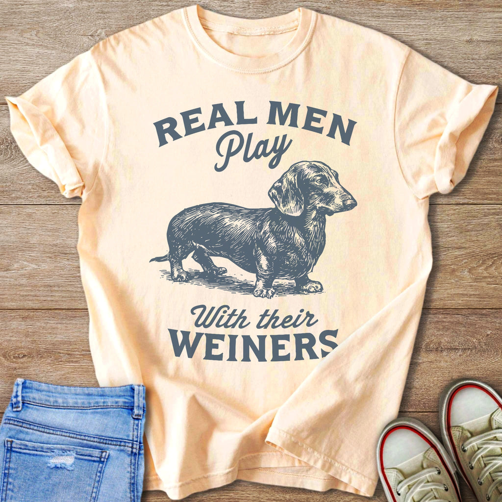 Peach t-shirt with sketched dachshund and text "REAL MEN Play With their WEINERS".
