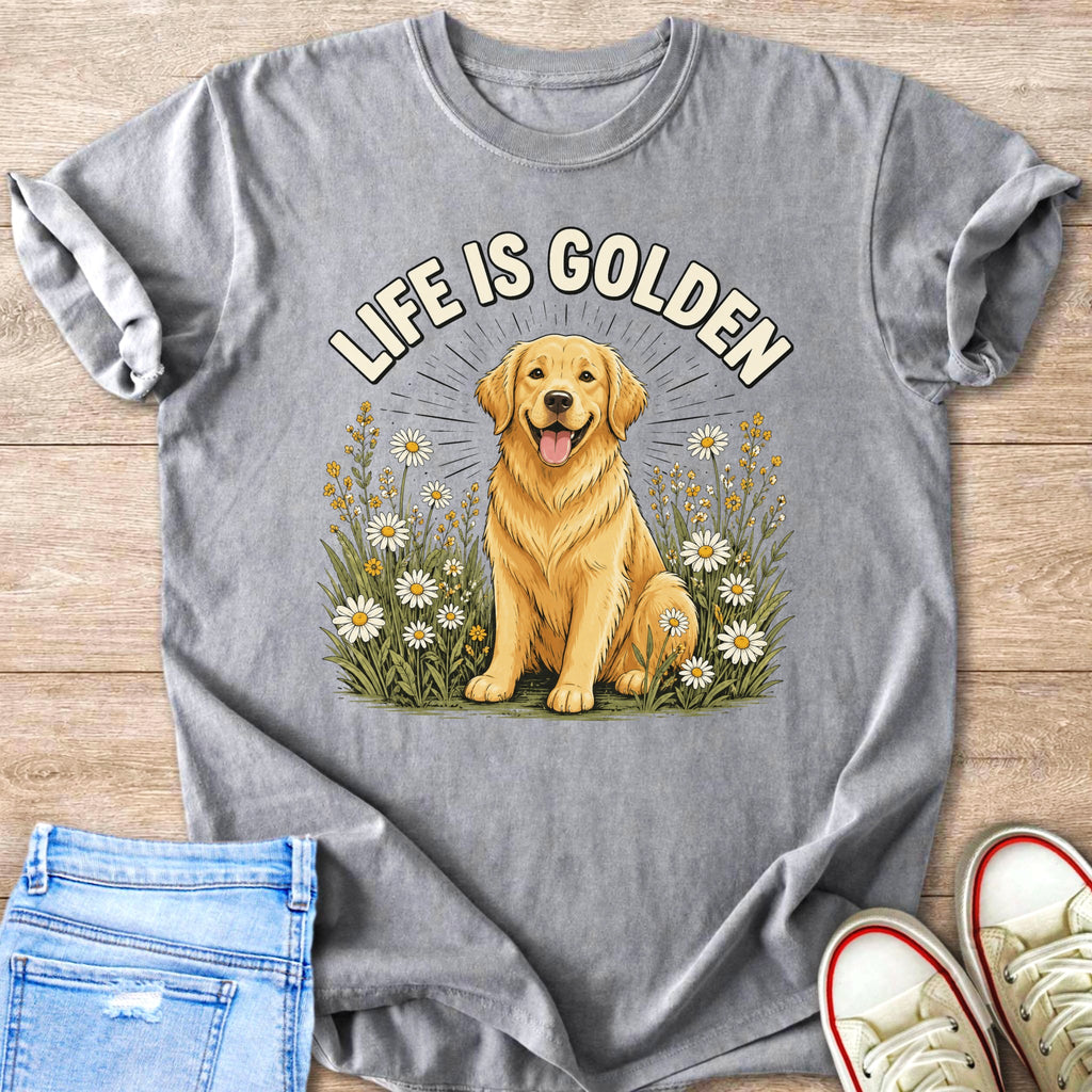 Golden retriever in field of daisies with text "LIFE IS GOLDEN" on gray t-shirt.