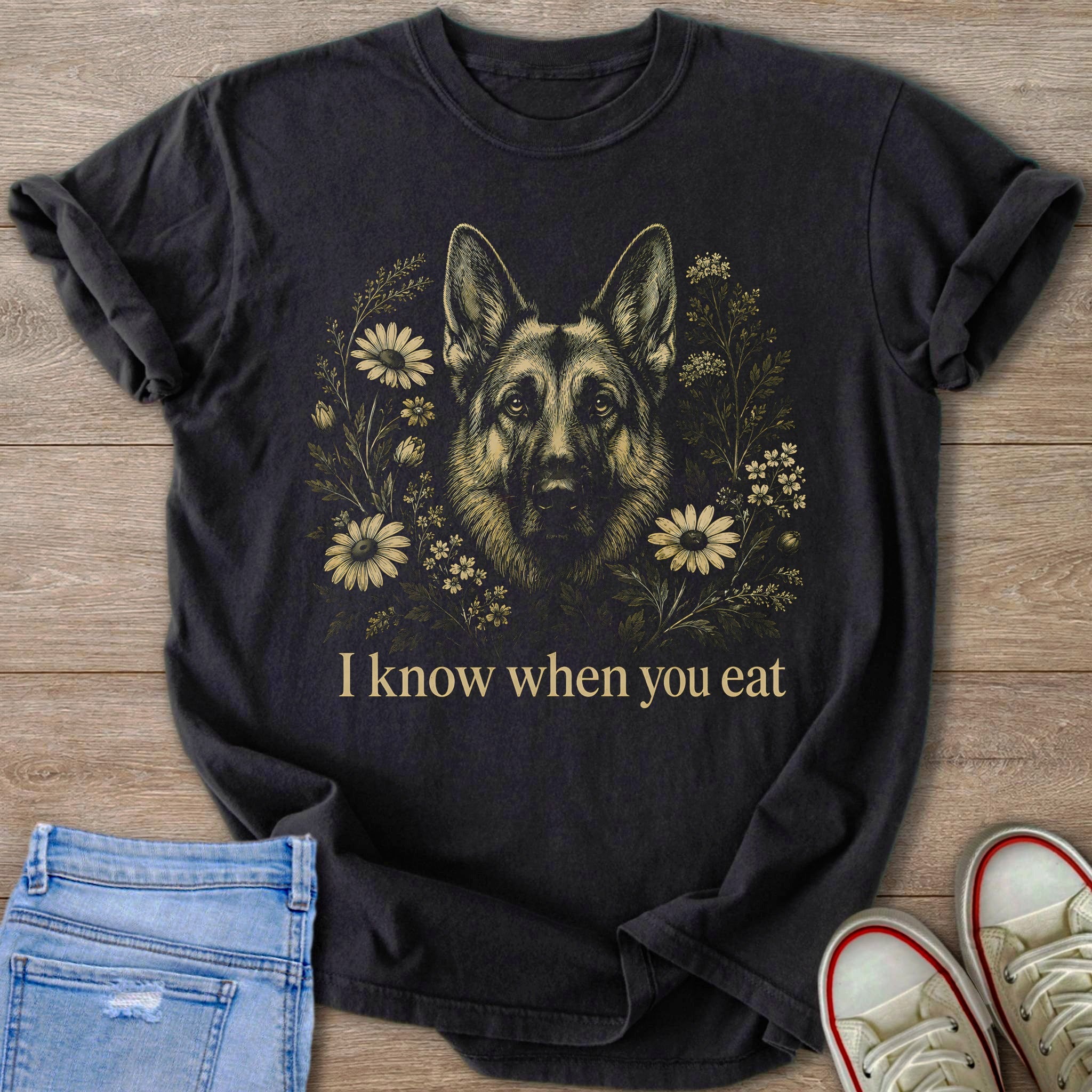 German Shepherd graphic with flowers and text "I know when you eat" on t-shirt.