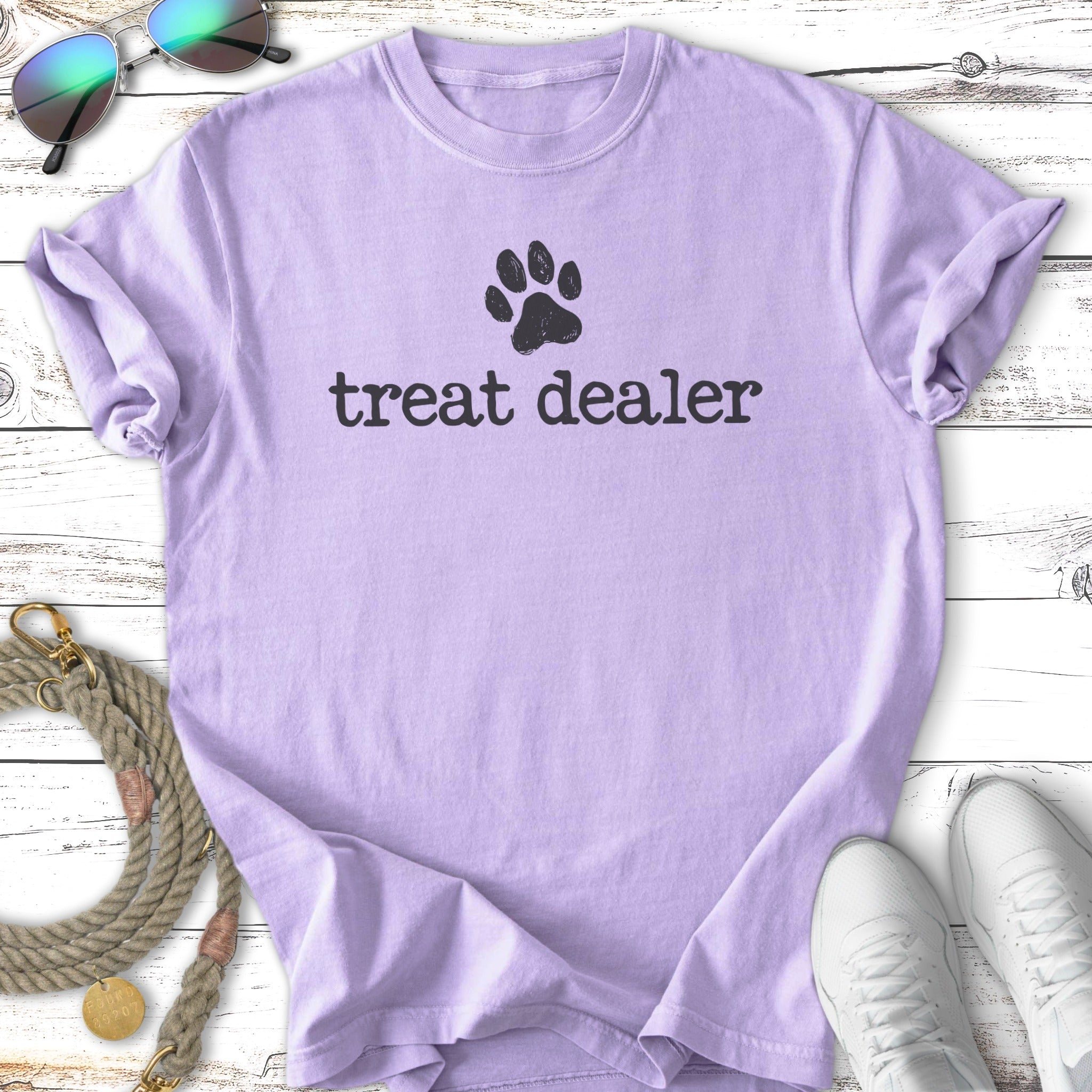 Lavender t-shirt with black "treat dealer" text and a paw print.