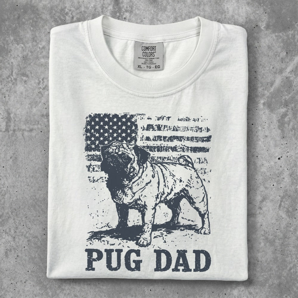 White t-shirt with pug and American flag graphic, text "PUG DAD".