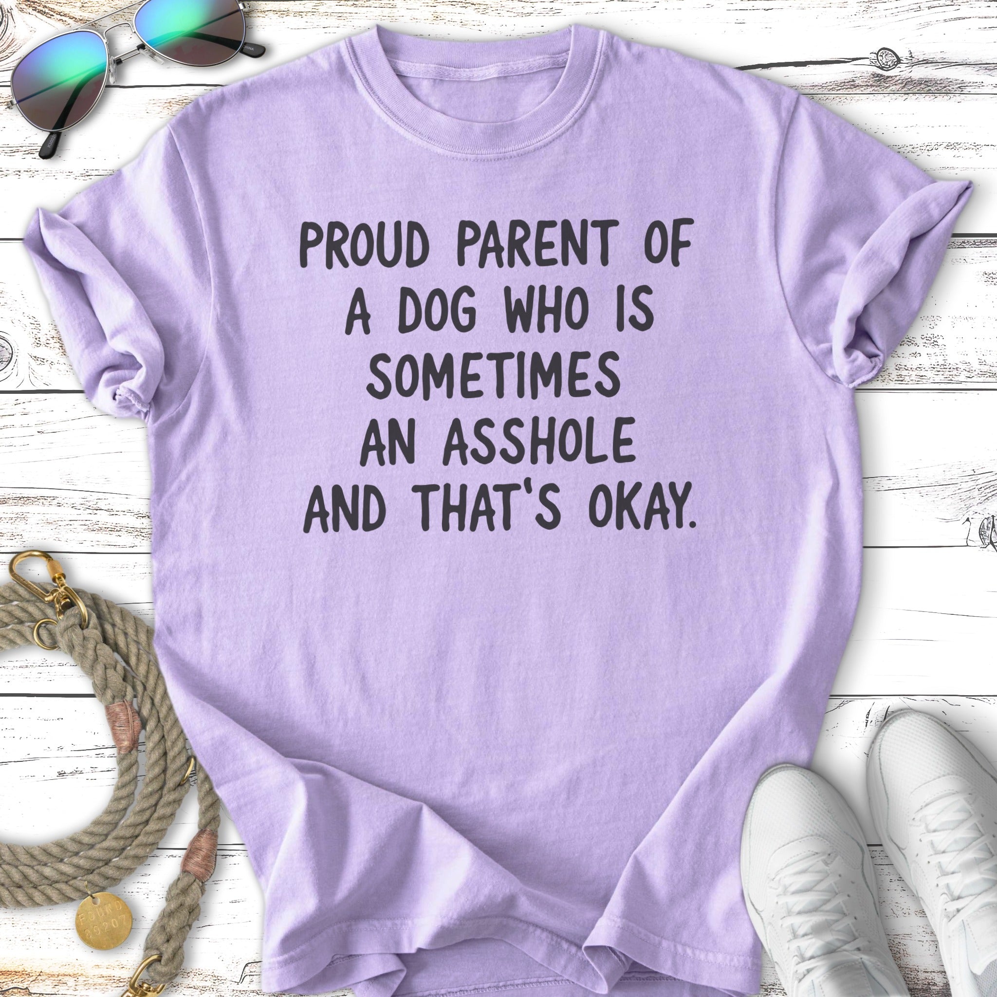 Purple t-shirt with "Proud parent of a dog who is sometimes an asshole and that's okay" text.