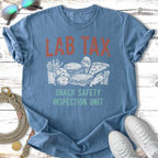 Blue t-shirt with "LAB TAX SNACK SAFETY INSPECTION UNIT" and food graphics.