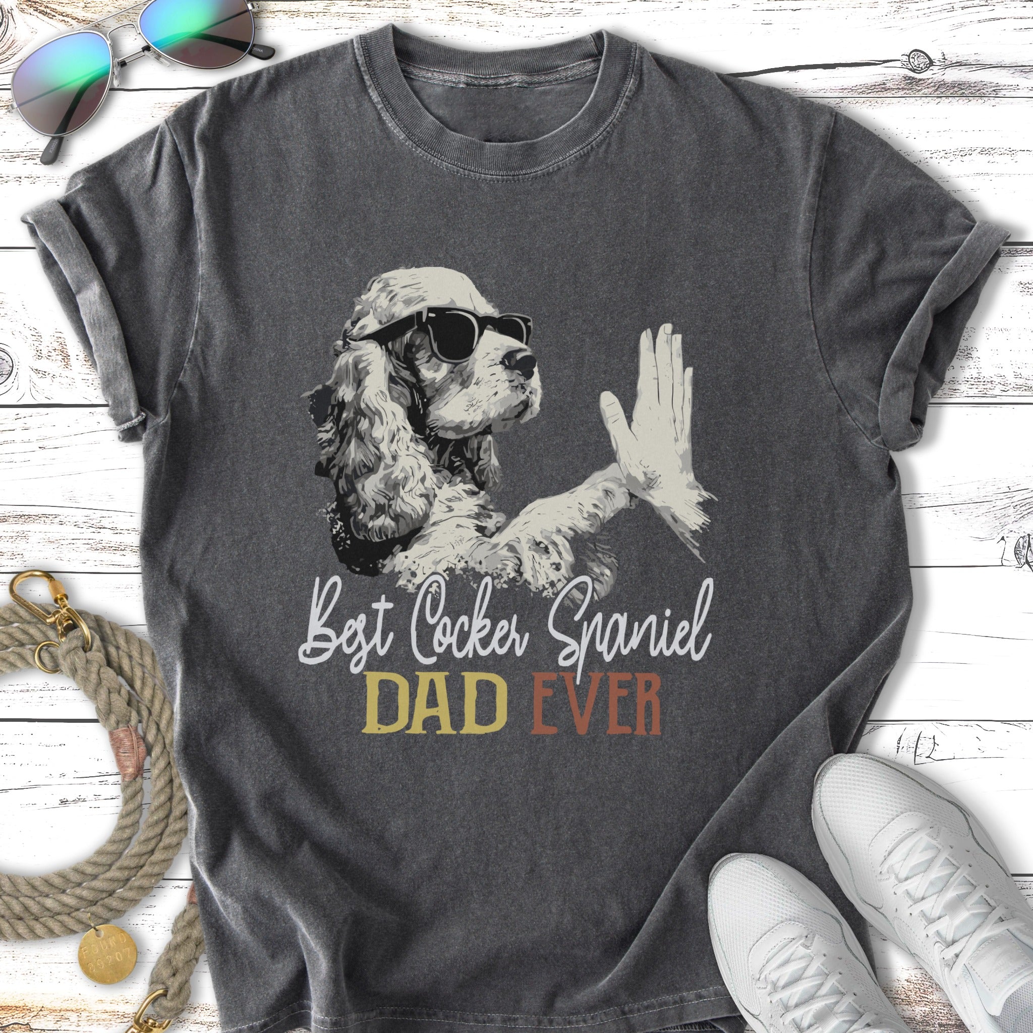 Best Cocker Spaniel Dad Ever graphic on charcoal t-shirt with sunglasses and rope.
