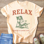 Peach t-shirt with "RELAX" and dog in a deck chair graphic.