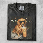 Golden retriever in sunglasses sips an iced coffee on a t-shirt.