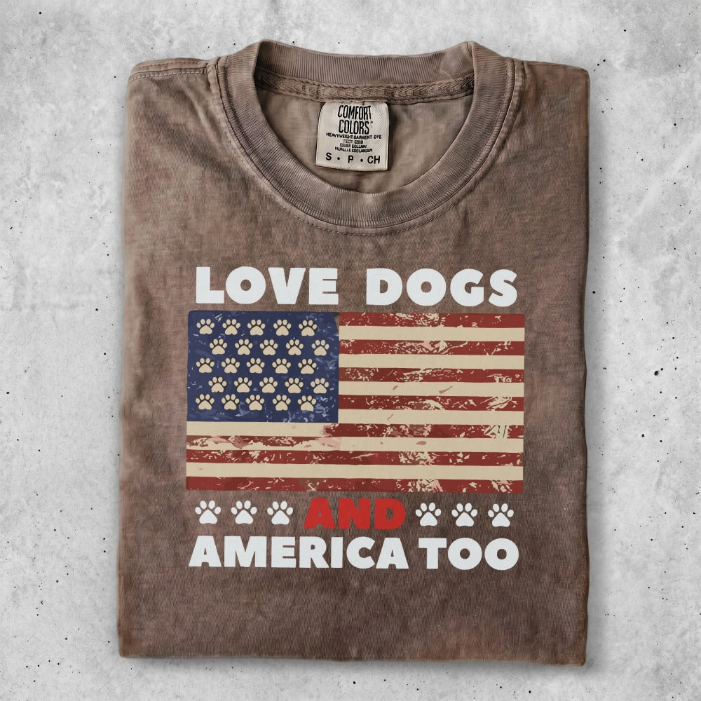 T-shirt with "Love Dogs and America Too" text and American flag with paw prints.