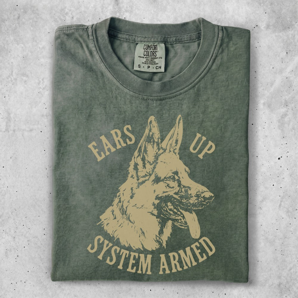 Green t-shirt with distressed print of a German Shepherd and text "EARS UP SYSTEM ARMED".