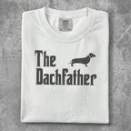 White t-shirt with "The Dachfather" text and dachshund silhouette.