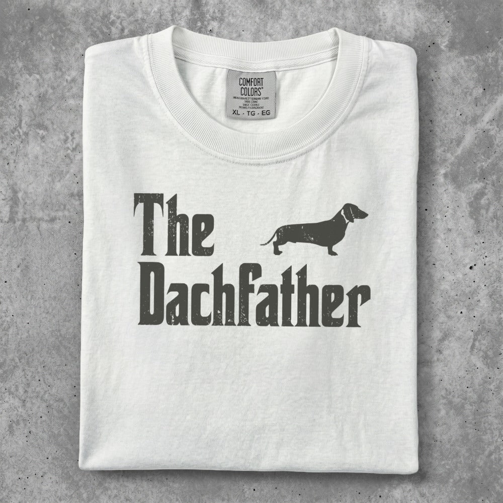 White t-shirt with "The Dachfather" text and dachshund silhouette.