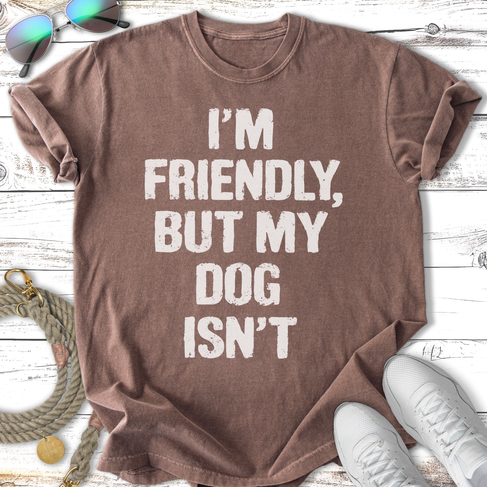 Brown t-shirt with "I'm friendly, but my dog isn't" graphic.