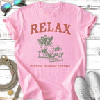 Pink t-shirt with French bulldog in beach chair, "RELAX NOTHING IS UNDER CONTROL" text.
