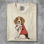 Beagle wearing red shirt with "I Love Mom" tattoo on arm.