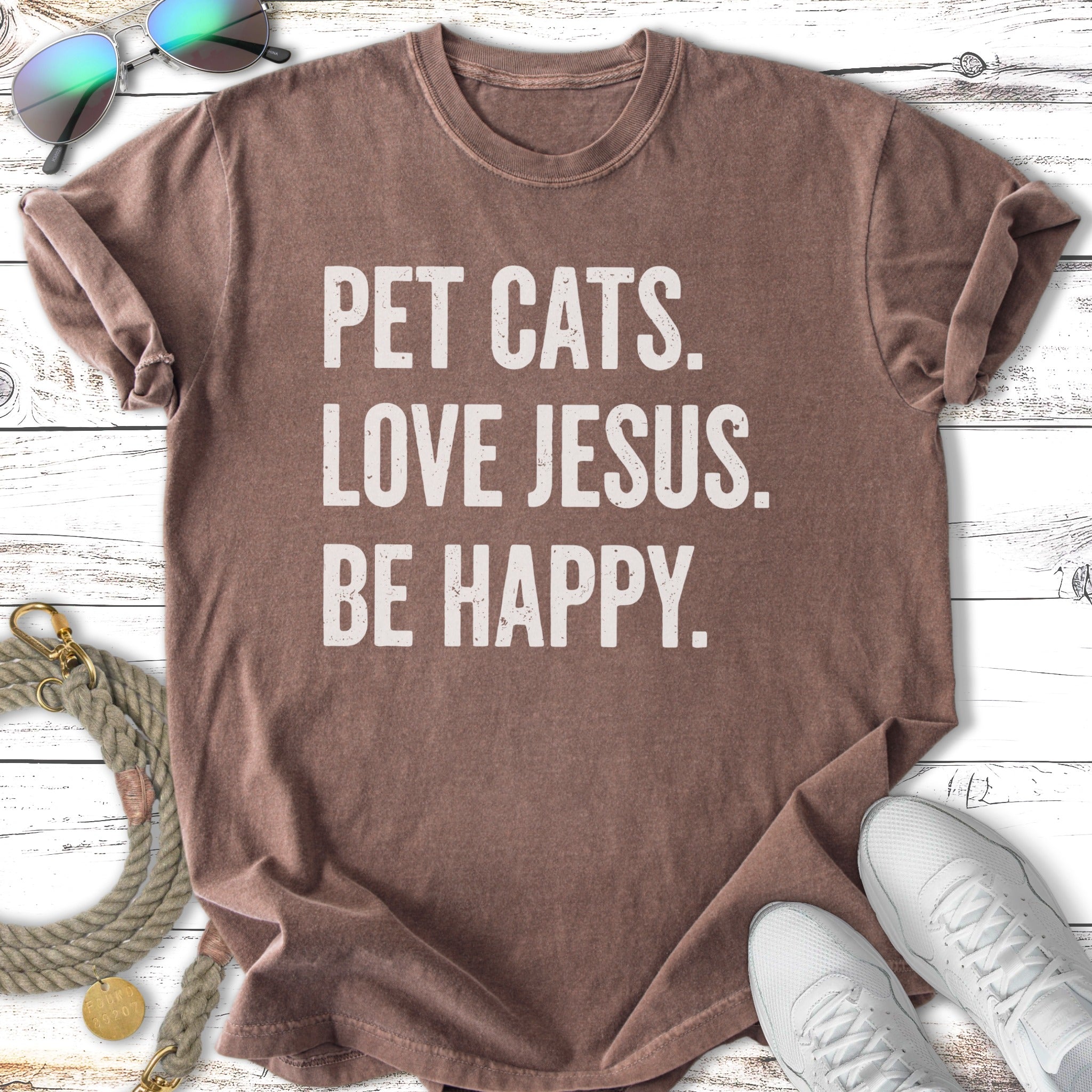 Brown t-shirt with "PET CATS. LOVE JESUS. BE HAPPY." text.