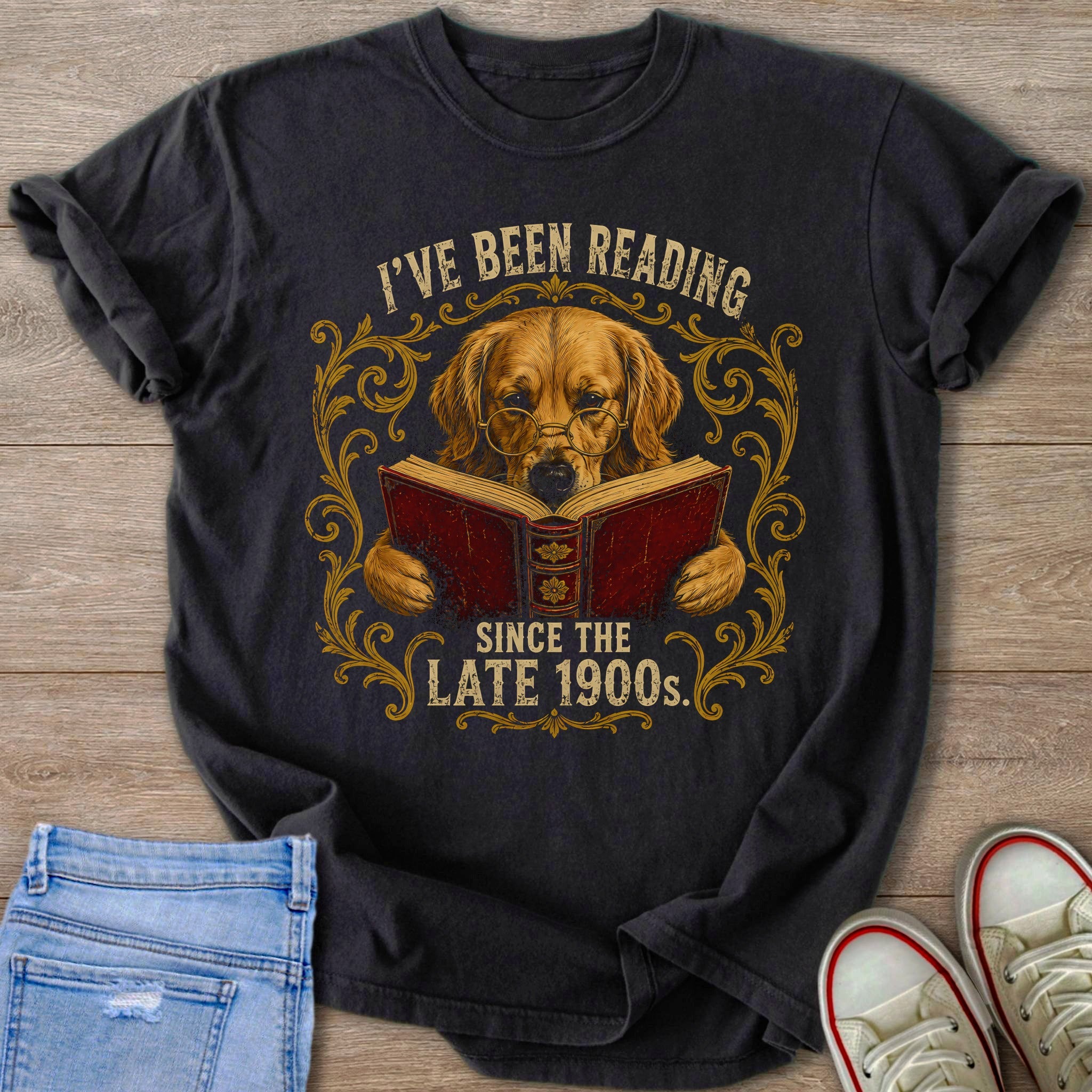 Dark t-shirt with Golden Retriever reading a book, saying "I've been reading since the late 1900s."